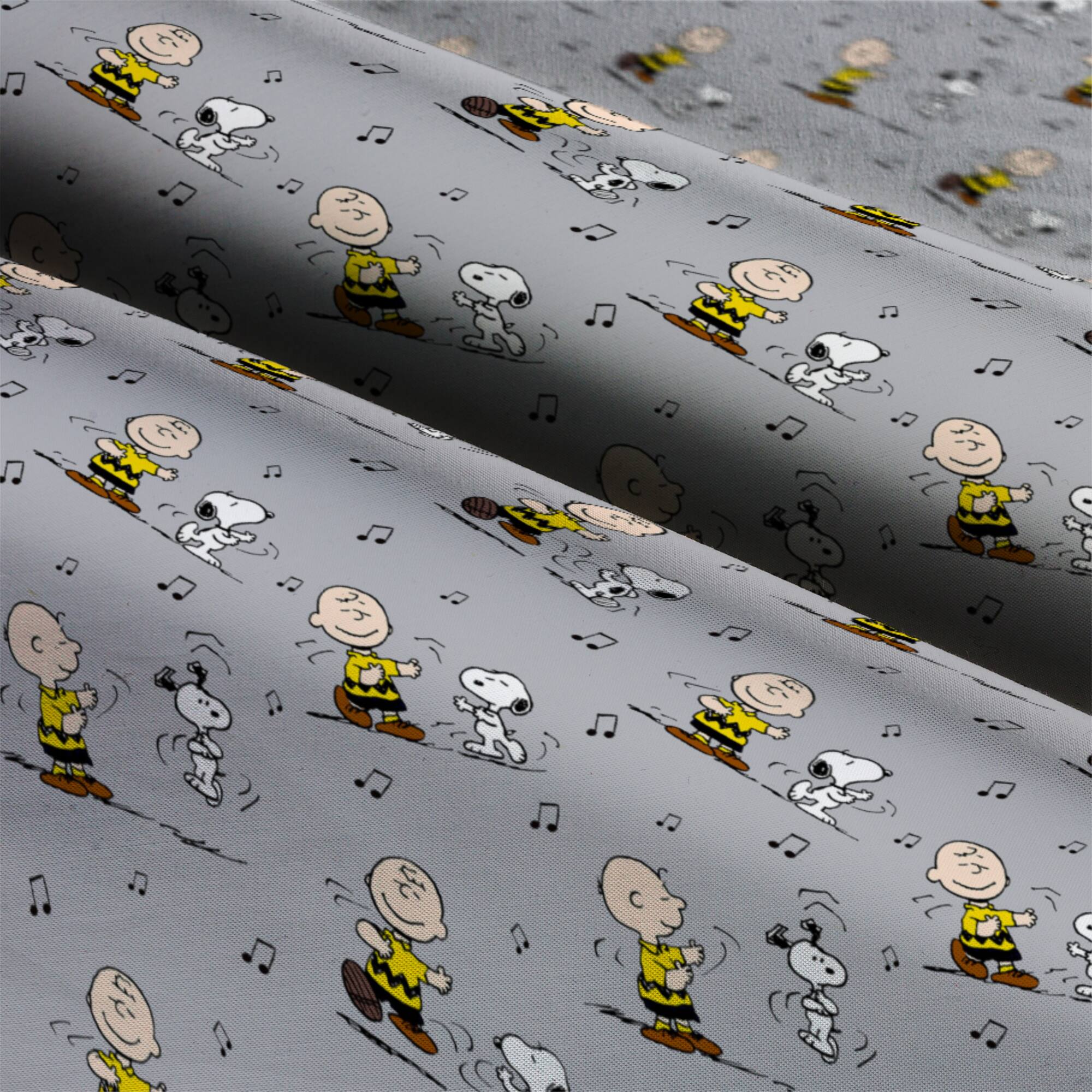 Peanuts® Charlie Brown & Snoopy Dance Cotton Fabric